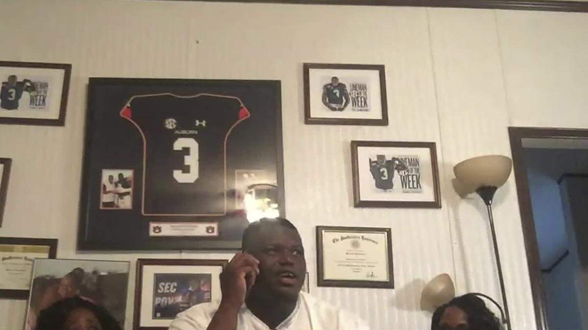 In this still image from video provided by the NFL, Marlon Davidson talks on the phone and is selected by the Atlanta Falcons during the second round of the NFL football draft, Friday, April 24, 2020.