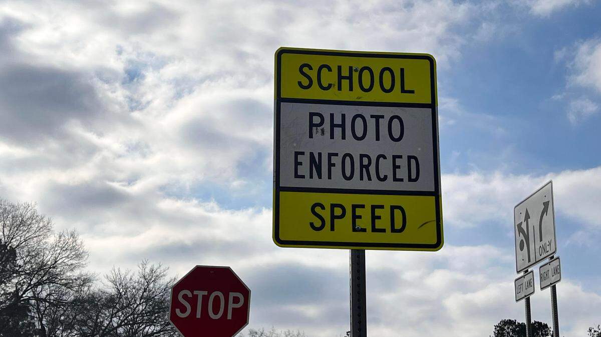 This sign informs drivers that automated cameras are being used to enforce the speed limit near Brookstone School in Columbus.