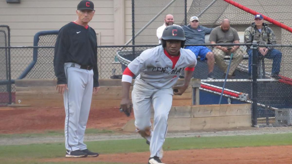 Central’s D.J. Rias takes off for home as head coach Bobby Howard watches during the Red Devils’ game against Northside on March 7, 2017.