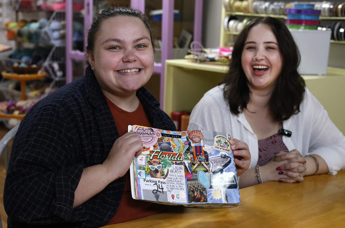 Olivia Fortson, left, and Sierra Wells, co-owners of Sticker & Stamp in Columbus, talk about junk journaling Jan. 8, 2026.