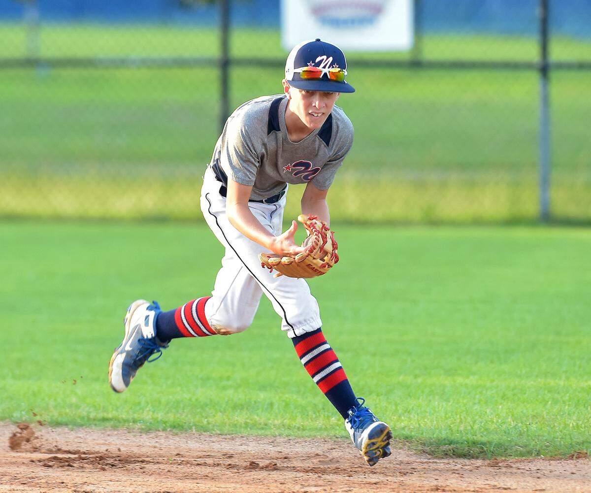 Carter Freiberg fields a ground ball at practice Thursday.