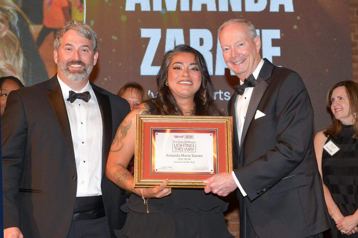 Amanda Zarate, a theater teacher at Wynnton Arts Academy, poses with Muscogee Educational Excellence Foundation chairman Wes Kelley, left, and Muscogee County School District superintendent David Lewis after she was announced as the MCSD 2025 Teacher of the Year during the MEEF gala May 1 in the Columbus Convention & Trade Center.