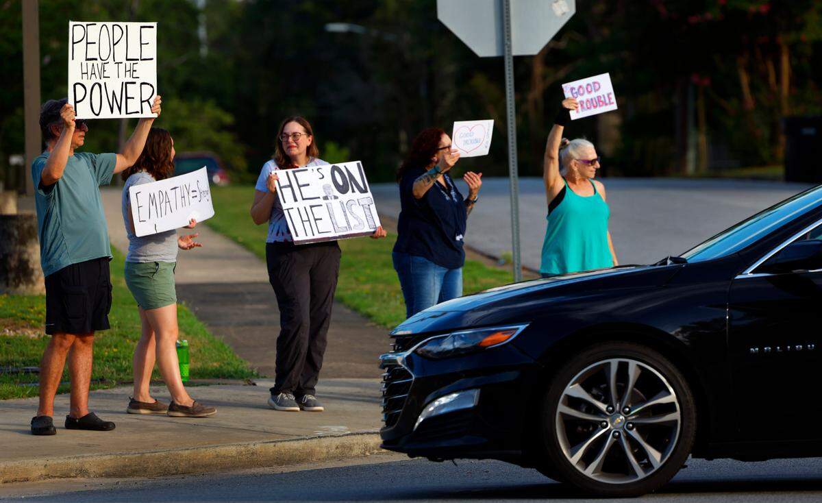 Local residents gathered July 17, 2025, at several intersection along Wynnton and Macon roads in Columbus as part of the “Good Trouble Lives On” protest to honor the legacy of civil rights activist and politician John Lewis of Georgia, who died July 17, 2020. The event was organized by Columbus Indivisible.