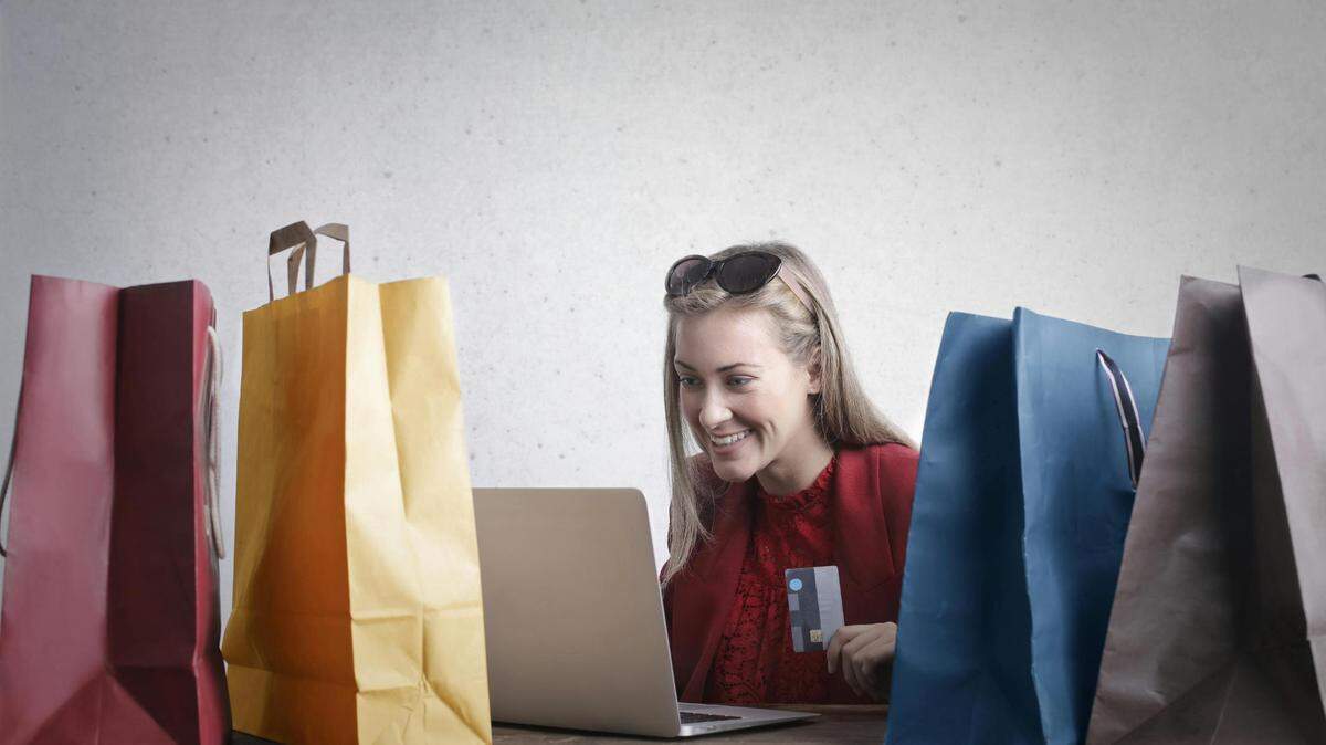 https://www.pexels.com/photo/happy-woman-shopping-online-at-home-3769747/