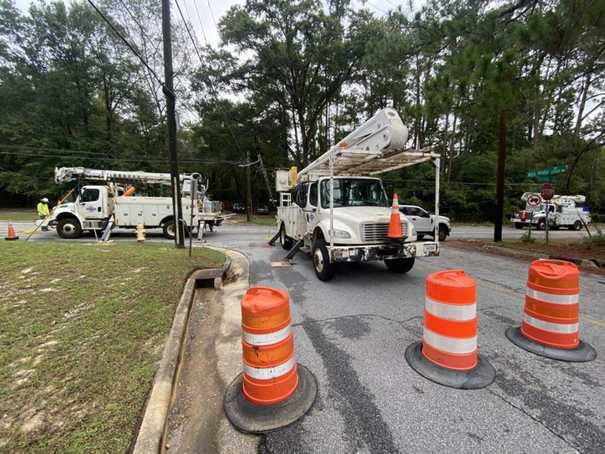 The intersection of Forrest Road and Alta Vista Drive is blocked in Columbus on Sept. 27, 2024, as a crew works to restore power to the neighborhood after the storm associated with Hurricane Helene came through the city.