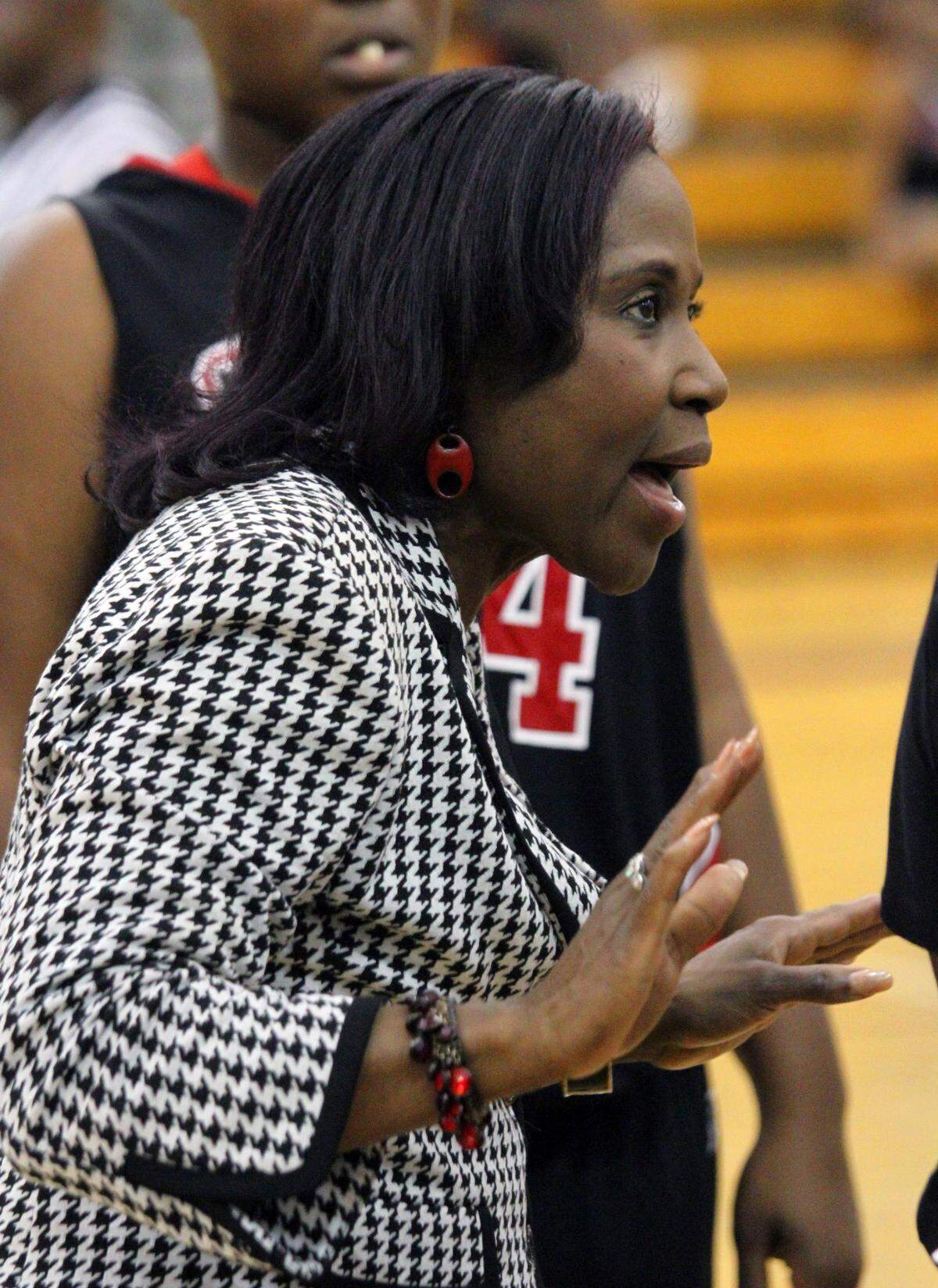 Central girls basketball coach Carolyn Wright talks to the team during a timeout against Northside Tuesday night at Northside.