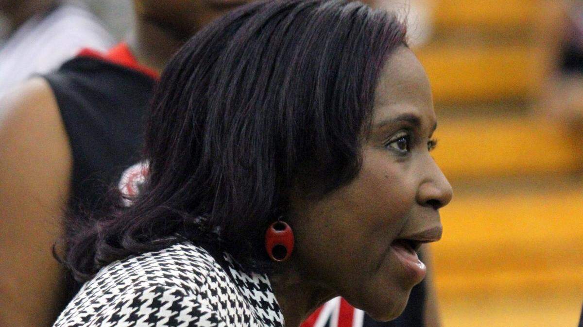 In this undated file photo, Central girls basketball coach Carolyn Wright talks to the team during a timeout against Northside.