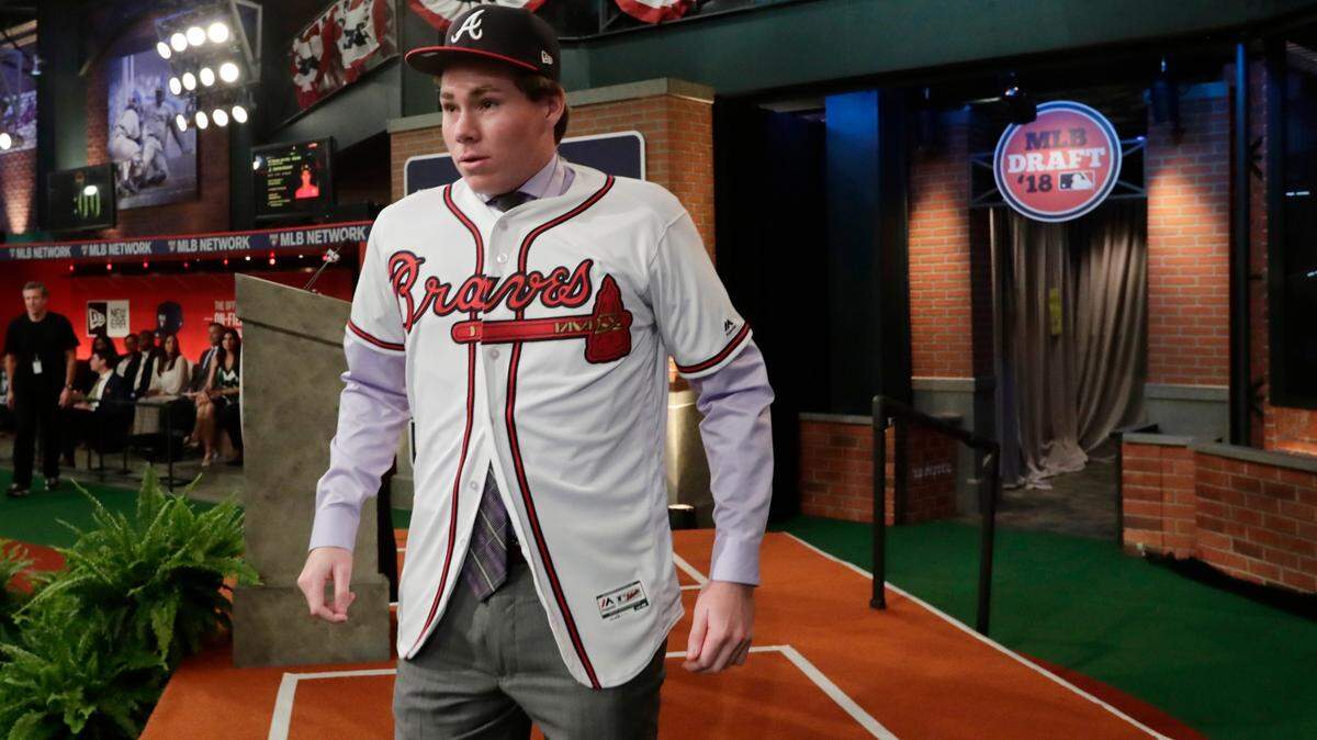 Carter Stewart, a pitcher from Eau Gallie High School in Florida, reacts after being selected eighth by the Atlanta Braves during the first round of the Major League Baseball draft Monday, June 4, 2018, in Secaucus, N.J.