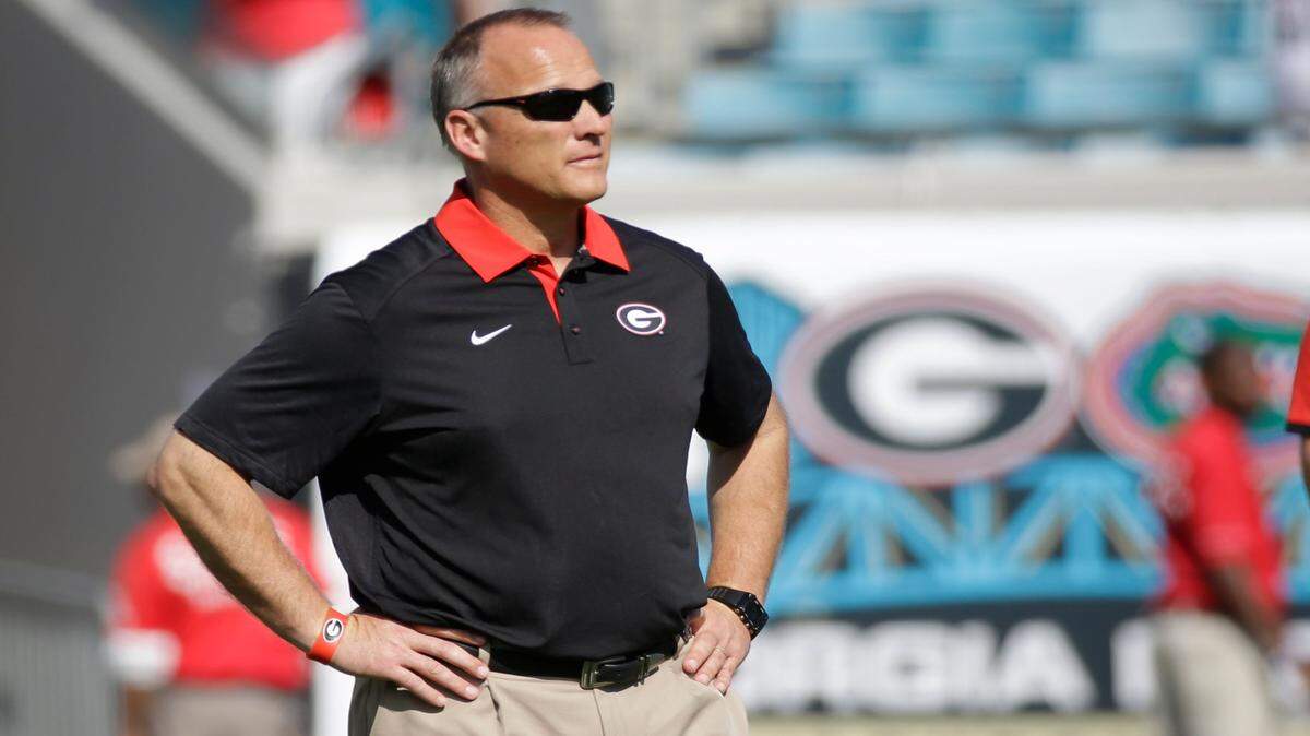JOHN RAOUX/Associated PressGeorgia head coach Mark Richt watches his team warm up Oct. 31 before the game against Florida, in Jacksonville, Fla. Losses in three of four games, including last week's ugly loss at Florida, have turned up the heat on Georgia coach Mark Richt, whose challenge entering this week's game against Kentucky is made more difficult by a growing crisis at quarterback.