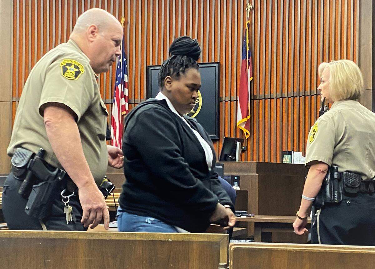 Courvoisia Wilson leaves court after a jury finds her guilty of crippling a Columbus man in a 2019 shooting.