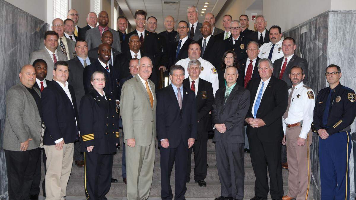 Participating agency heads following the credentialing ceremony Thursday, Jan. 11, at the Alabama state capitol. Included in the group are ADECA Director Kenneth Boswell, fourth from left, and ALEA’s Secretary of Law Enforcement Hal Taylor, fifth from left.