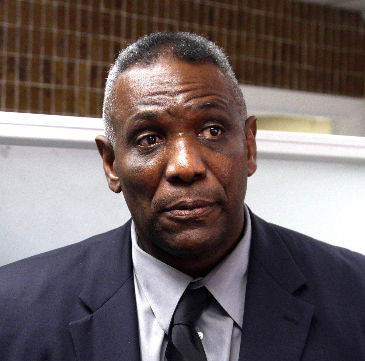 Former Central High School head football coach Woodrow Lowe speaks to the media in December 2014 after addressing the Phenix City Board of Education. He was relieved of his duties as head coach in May of that year.