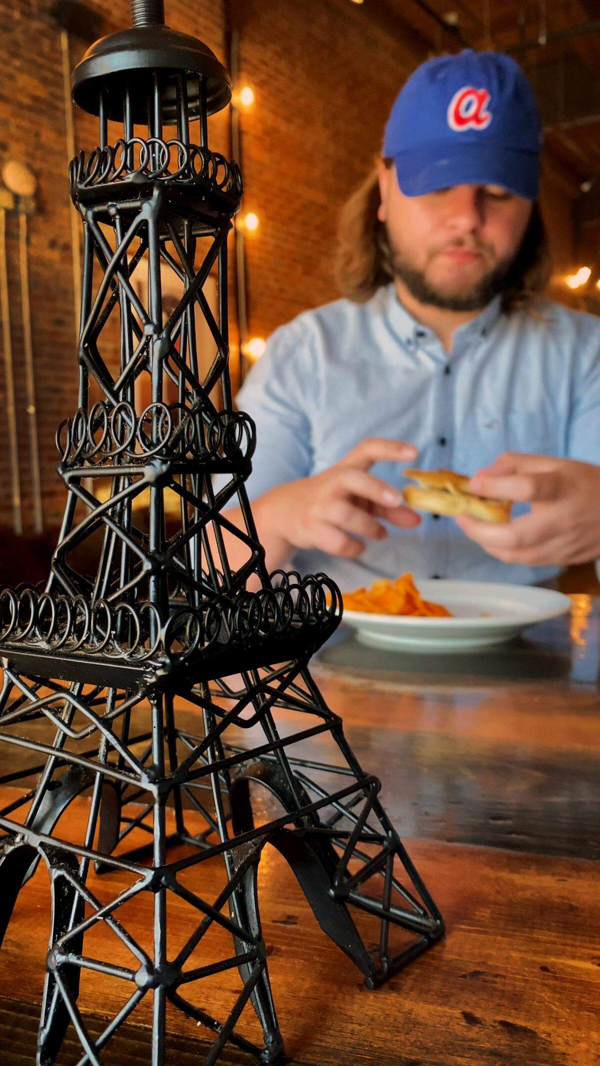 Ledger-Enquirer reporter Kelby Hutchison ordered the Muffaletta sandwich (Genoa Salami, Mortadella, Olive Mix, Provolone, and Swiss) on Ciabatta bread and a side of chips at The Tower & My Boulánge in Columbus, Georgia.