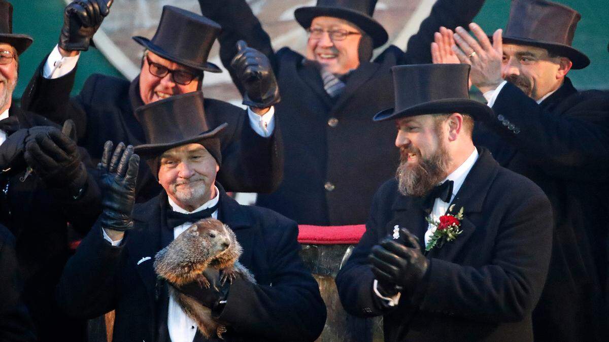 Al Dereume holds Punxsutawney Phil, the weather prognosticating groundhog, during the 132nd celebration of Groundhog Day on Gobbler’s Knob in Punxsutawney, Pa. on Feb. 2, 2018.