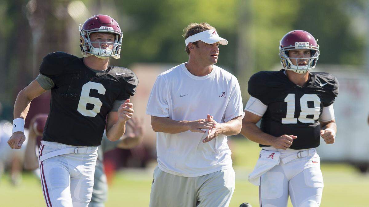 In this Aug. 26, 2015, file photo, Alabama quarterbacks Blake Barnett (6) and Cooper Bateman (18), under the watch of offensive coordinator Lane Kiffin, work on a drill during football practice in Tuscaloosa, Ala. For the third straight season Alabama has no clear-cut starting quarterback. Bateman is the presumptive front-runner after he lost out to Jake Coker last year. Barnett is the five-star future franchise QB.