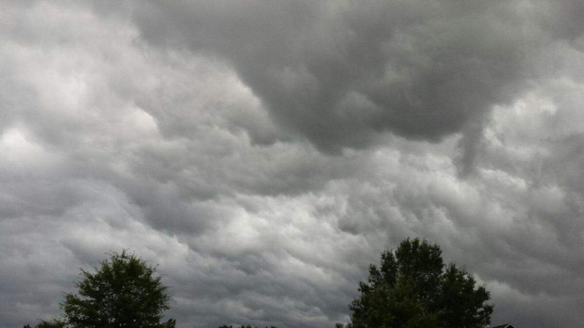 Dark storm clouds form in the skies over east Alabama on Saturday prior to thunderstorms rolling through the area, with a low-end tornado spotted in Opelika, Ala.