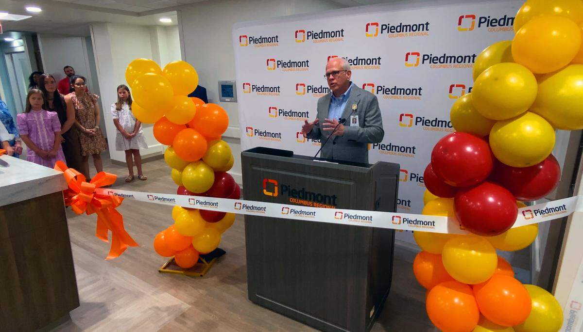 Piedmont Columbus Regional CEO Scott Hill speaks at the ribbon-cutting ceremony Monday to celebrate the completion and naming of a $58 million expansion and renovation project that has increased the hospital’s critical care capacity. Named the Shelby and Wanda Amos Intensive Care Unit, the 99,038 square foot project includes 43 new ICU beds, plus 68 renovated rooms, across three nursing units. 05/11/2026