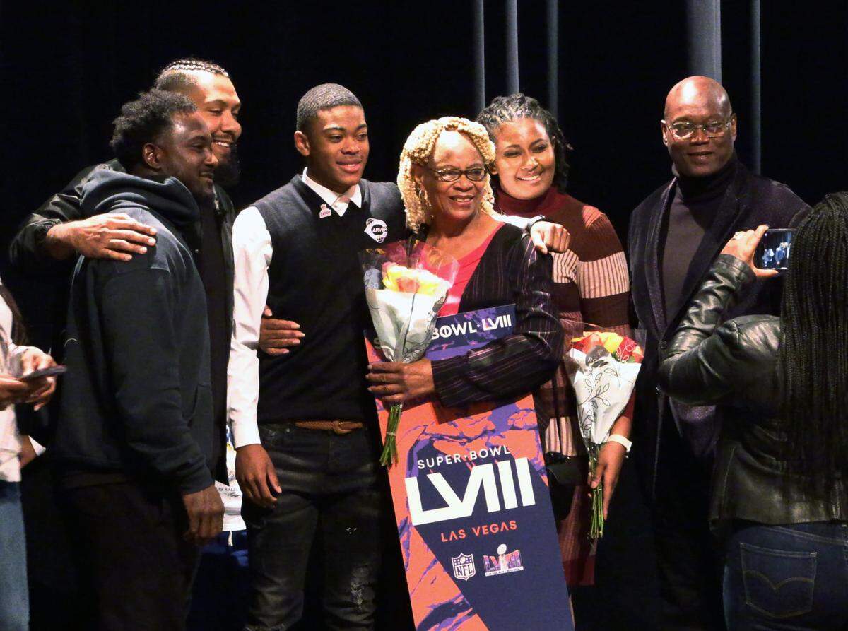 George Washington Carver High School junior Braylon Jakes, third from left, learned during Friday’s assembly that the NFL is providing two tickets for him and a guest to attend Super Bowl LVIII in Las Vegas. 11/03/2023