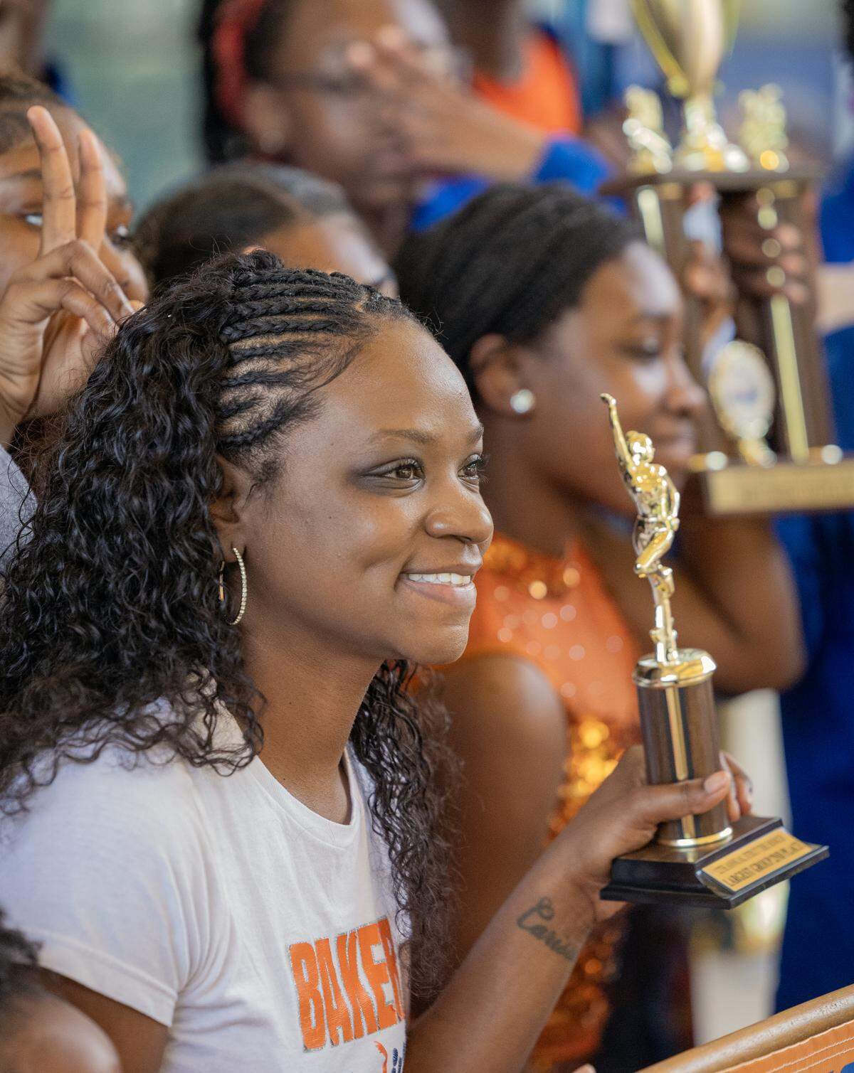 Members of the Baker Middle School marching band pose for a photo after receiving an award for their performance at the Strut the Hooch parade May 2, 2026, in downtown Columbus.
