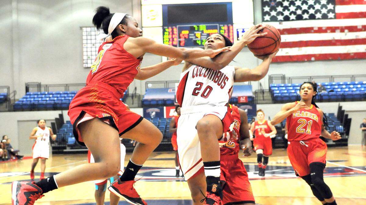 DARRELL ROADEN/photo@ledger-enquirer.comCSU's Michelle Mitchell drives to the basket against Flagler's Deasha Campbell in the fourth period of the game Wednesday night at the CSU Lumpkin Center. CSU won 83-57.