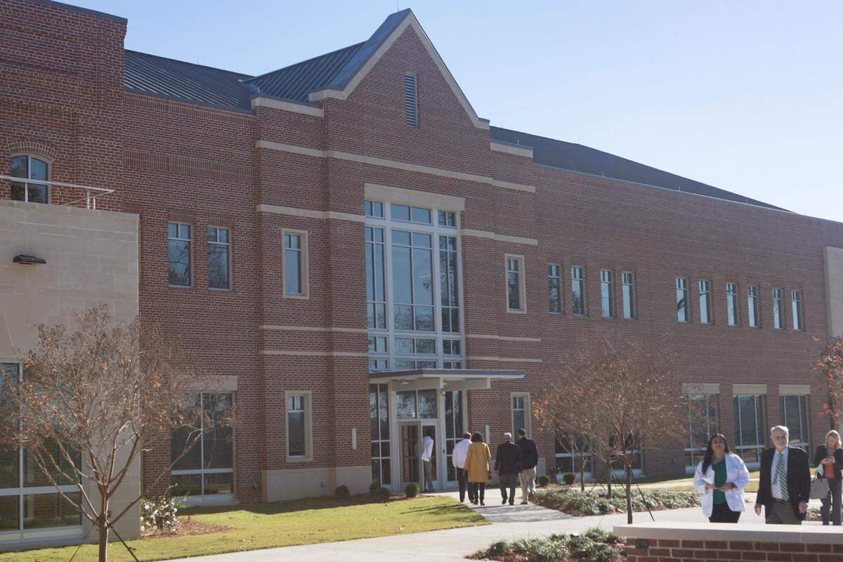 A ribbon cutting is held for the Mercer University School of Medicine’s new Columbus campus on Dec. 14, 2021.
