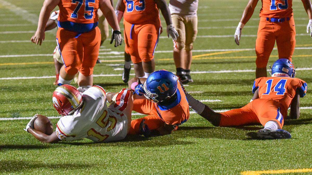 Hardaway quarterback Javion Toney runs up the middle against the Columbus defense for a touchdown in the second quarter of the game Friday night, October 19, 2018, at Kinnett Stadium.