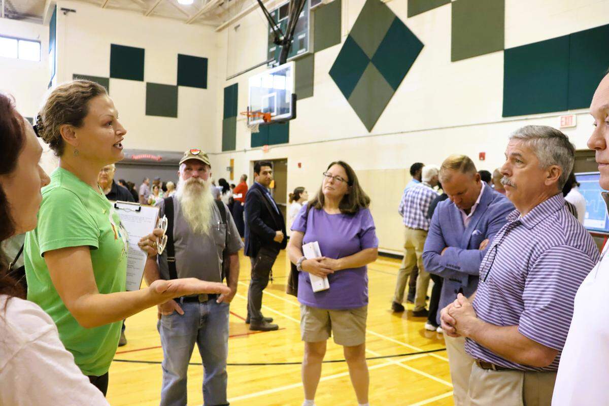 During a forum March 23, 2026, at the Psalmond Road Recreation Center in Columbus, resident Andrea Atkins presses Atlas Development representatives about Project Ruby, a proposed hyperscale data center. She asks them questions about previous Texas projects that they decline to provide answers to.
