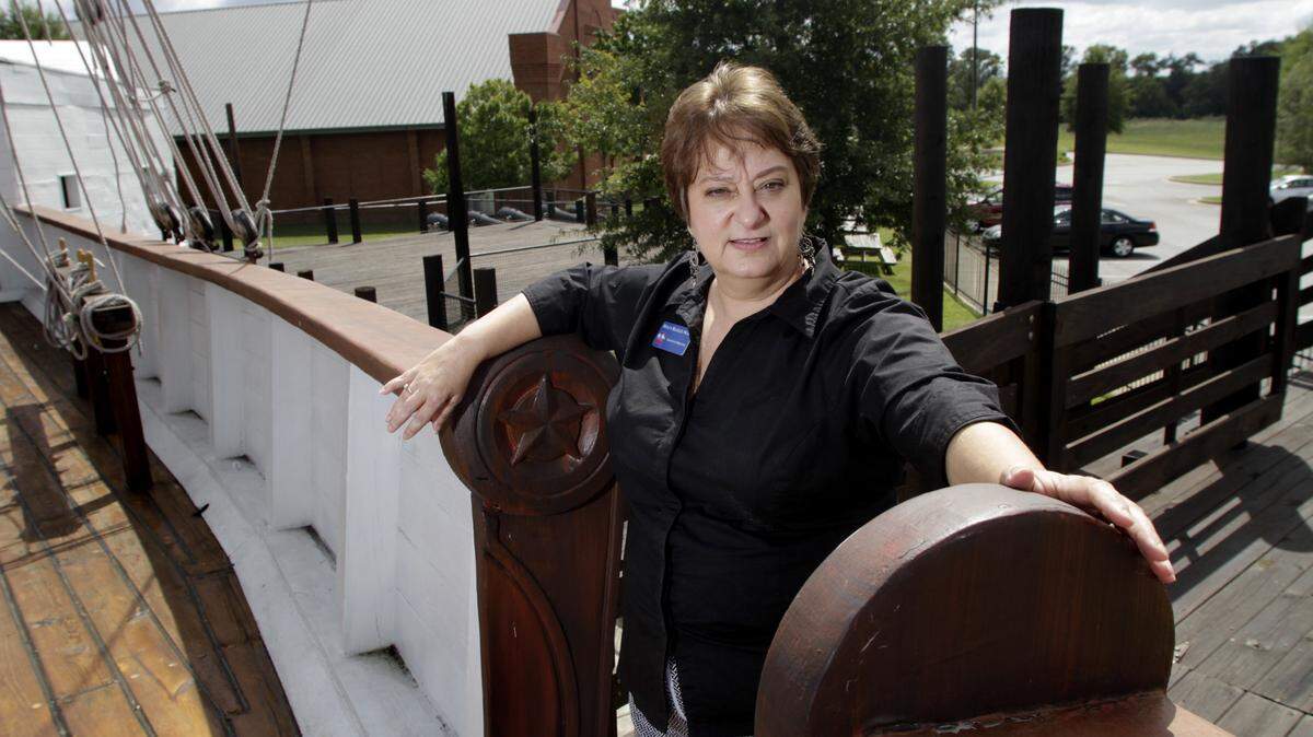 ROBIN TRIMARCHI/rtrimarchi@ledger-enquirer.comExecutive Director Holly Beasley Wait stands on the Water Witch at the National Civil War Naval Museum at Port Columbus.
