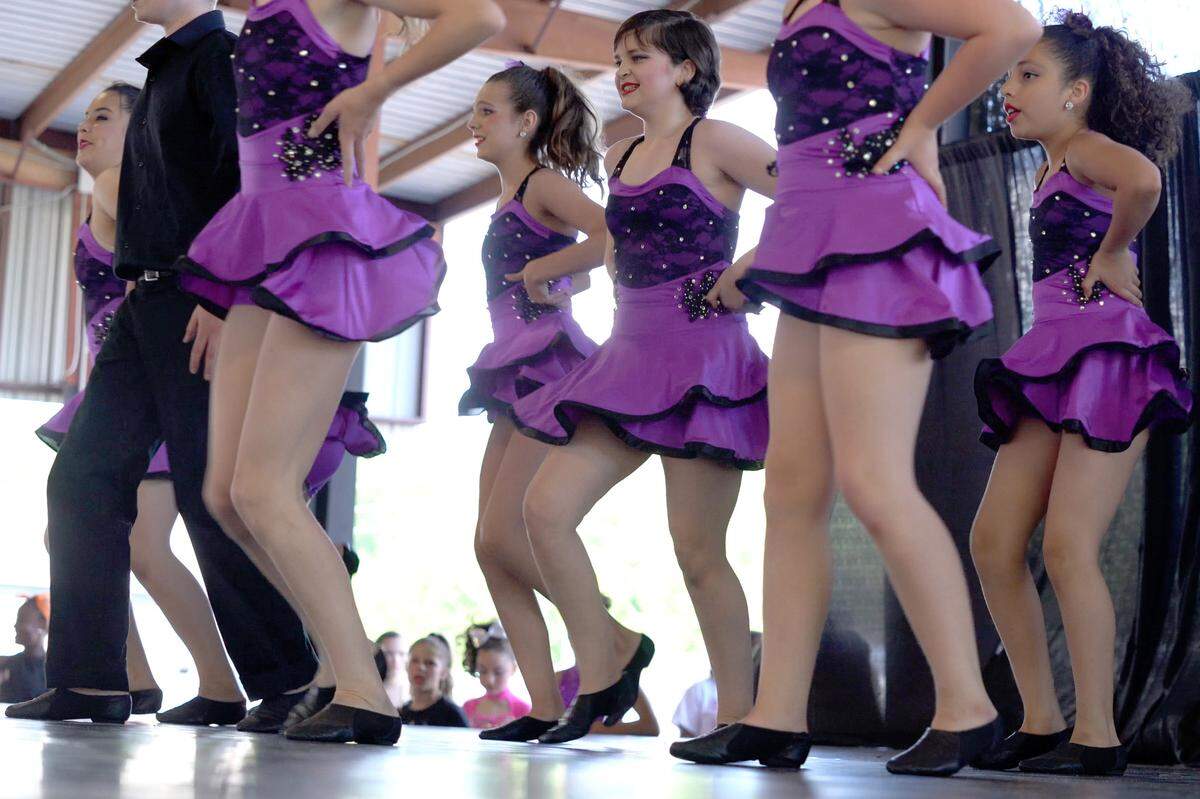 Seventh-grader Lexy McRae performs at her first dancing recital, on May 29, 2021, since an osteosarcoma diagnosis, at the Harley Davidson store in Columbus, Ga.