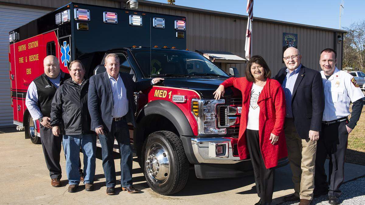 Smiths Station Mayor Bubba Smith, Commissioner Gary Long, Commissioner Robert Ham, State Representative Debbie Wood, State Senator Randy Price, and Dep Chief Daniel Sexton standing next to Smiths Station Fire & Rescues’ new Ambulance delivered December 2018 at a cost of $195,902.25 with an estimated $20,000.00 of Ambulance Equipment, December 18, 2018