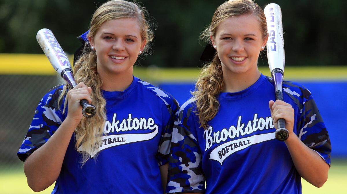 Mike Haskey/mhaskey@ledger-enquirer.comHelen Snavely, left, and sister Katherine Snavely, pose for a photograph prior to a recent Brookstone softball team practice.