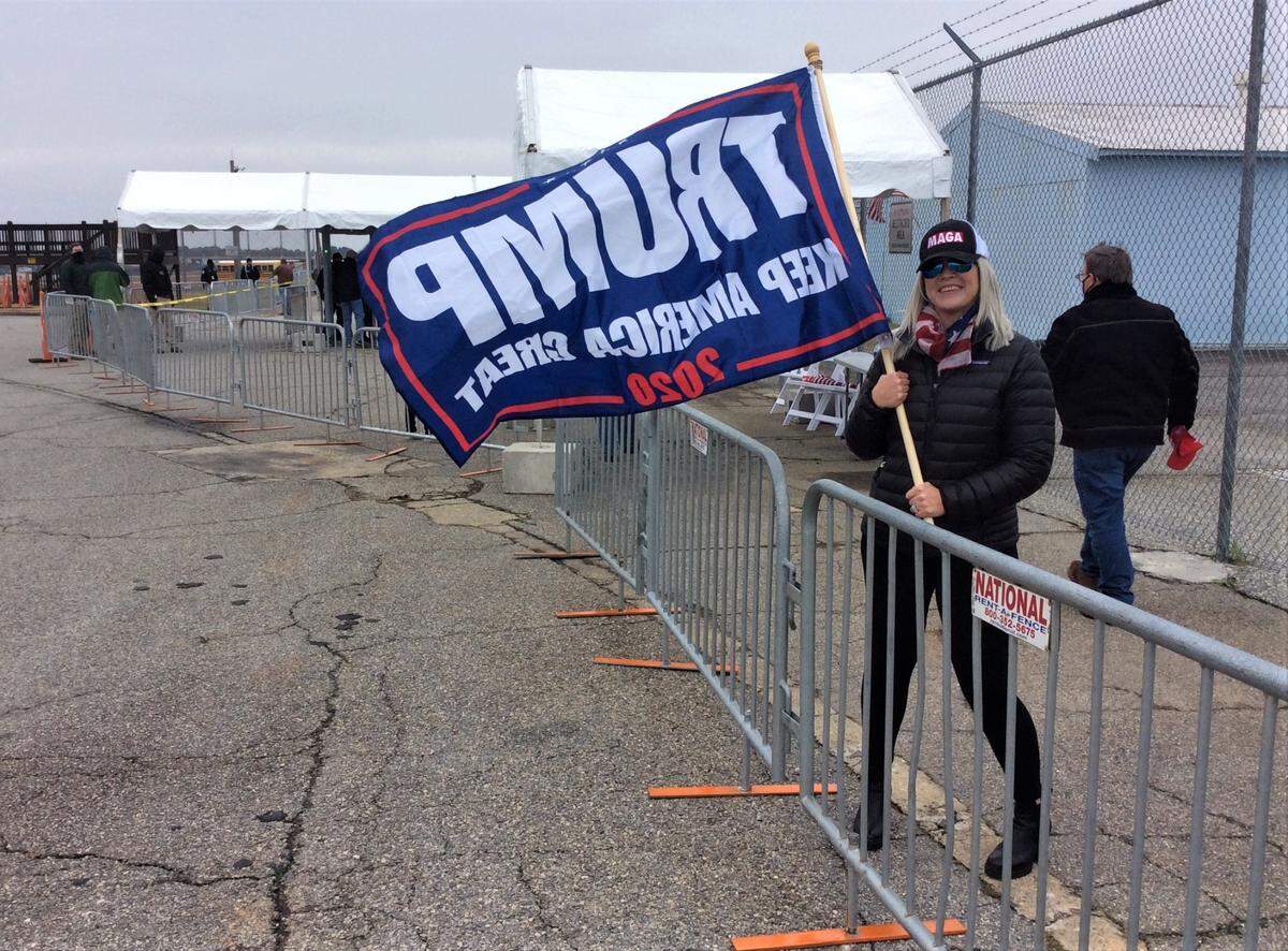 Alyce Ellis of Smiths Station, Alabama, brought her Trump 2020 flag to Vice President Mike Pence’s rally at the Columbus airport.