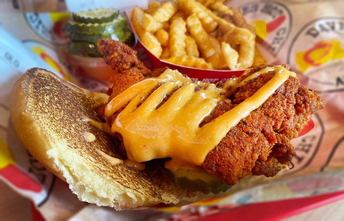 This is the Dave’s #4: a slider with fries combination at Dave’s Hot Chicken in Columbus, Georgia. The slider is served on a potato bun with kale slaw, pickles and drizzled with Dave’s sauce. 01/28/2025