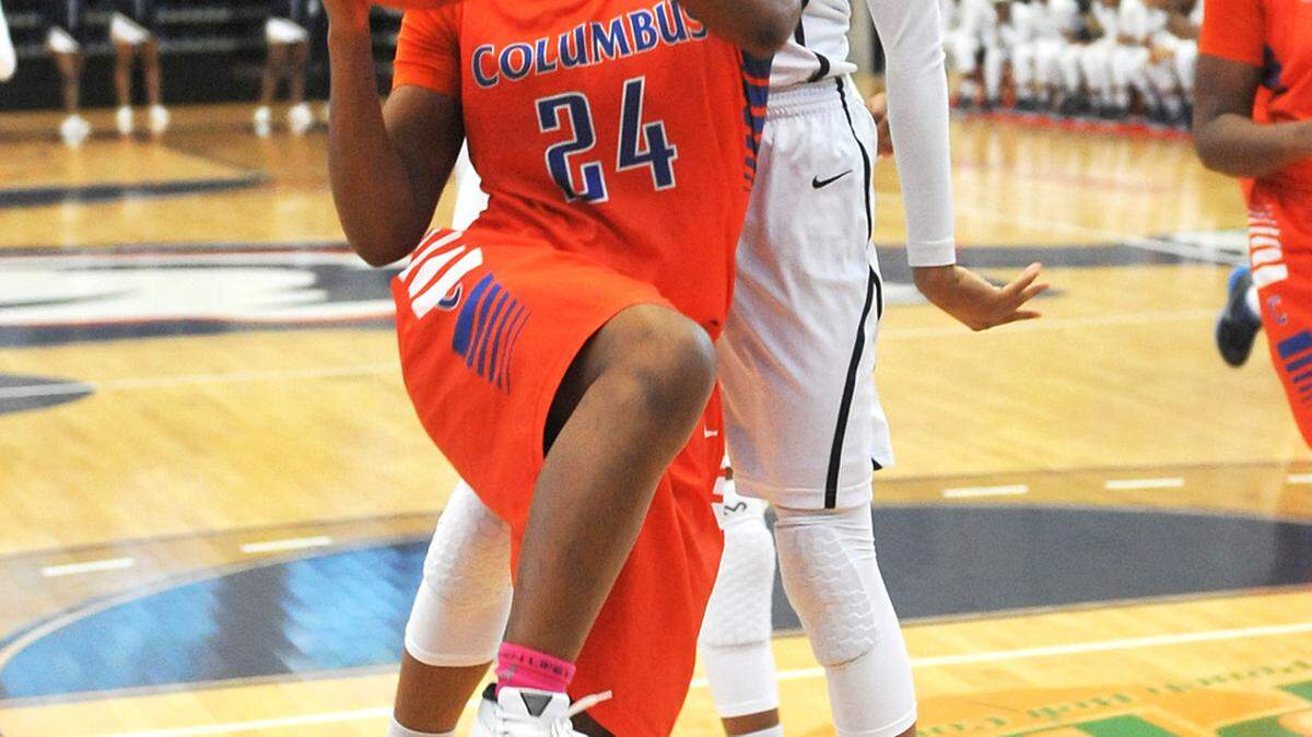 Columbus'  Trinity Vasquez up to the basket against Southwest DeKalb's Chantz Cherry in the 2nd period of the GHSA quarterfinals playoff game at Columbus State University Friday, February 26, 2016  