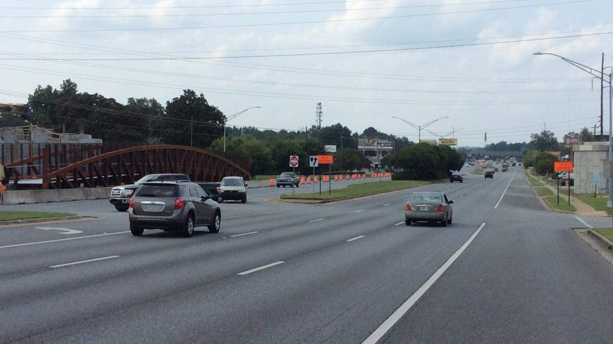 Detours are in place along Victory Drive while a contractor erects a bridge across the roadway for the Follow Me Trail.