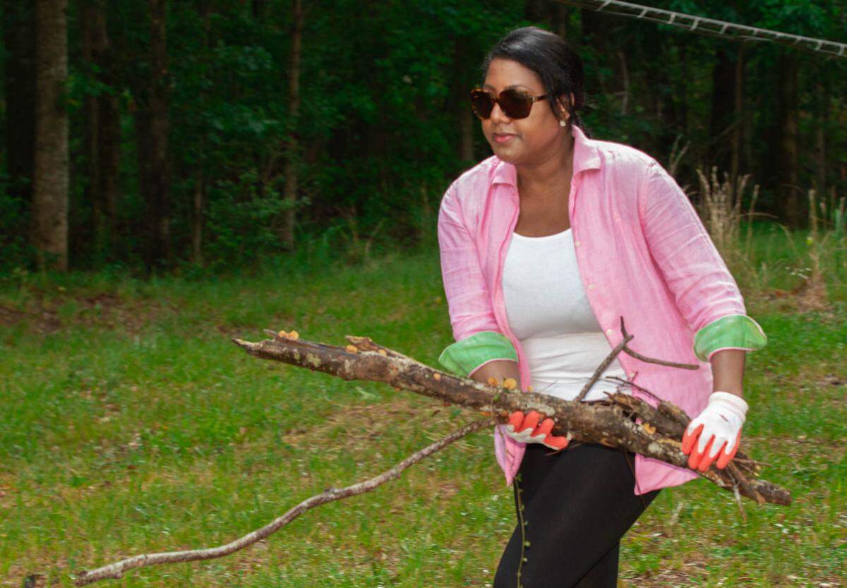 Yamona Pierce, founder of the Hamilton Hood Foundation, works to clean up the Pierce Chapel Cemetery in Midland, Georgia after she learned of its dilapidated condition. Some of Pierce’s ancestors were buried there.
