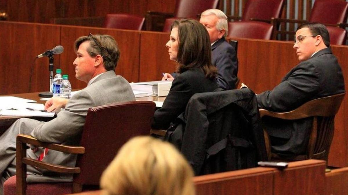 Muscogee County Sheriff John Darr,far right, and his attorneys, from left, Kerry Howell, Kellye Moore and Larry Walker listen as opposing council Carter Schondelmayer argues on behalf of the city of Columbus at a hearing last year.