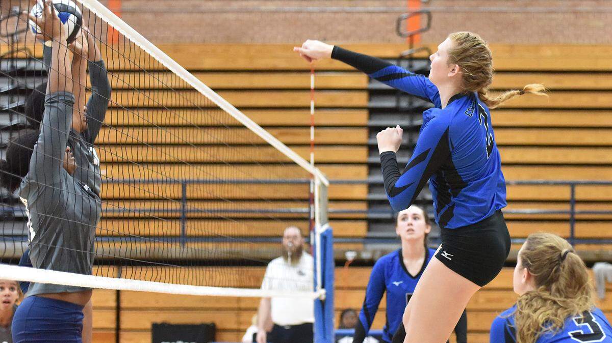 Columbus’  Savannah Ogle scores over the block attempt by Luella during the first round of the Georgia Class AAAA state volleyball playoffs Saturday October 20, 2018, in the Columbus High School gym.