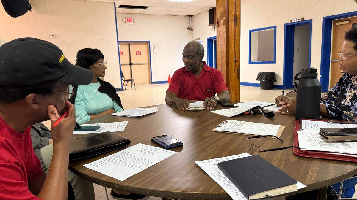 Executive director Richard Jessie, third from left, meets May 12, 2025, with members of Liberty District Inc. at Prince Masonic Temple, 815 Sixth Ave., in Columbus.
