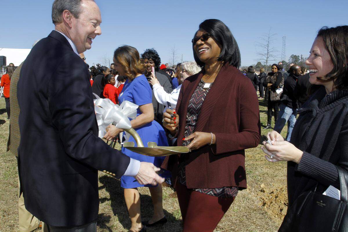 ROBIN TRIMARCHI rtrimarchi@ledger-enquirer.com. Muscogee County School District Superintendent David Lewis holds a ceremonial shovel for Georgia Rep. Carolyn Hugley, center, and MCSD school board member Shannon Smallman, right, to sign following groundbreaking ceremony for the new Rainey-McCullers School of the Arts in Columbus in 2016.