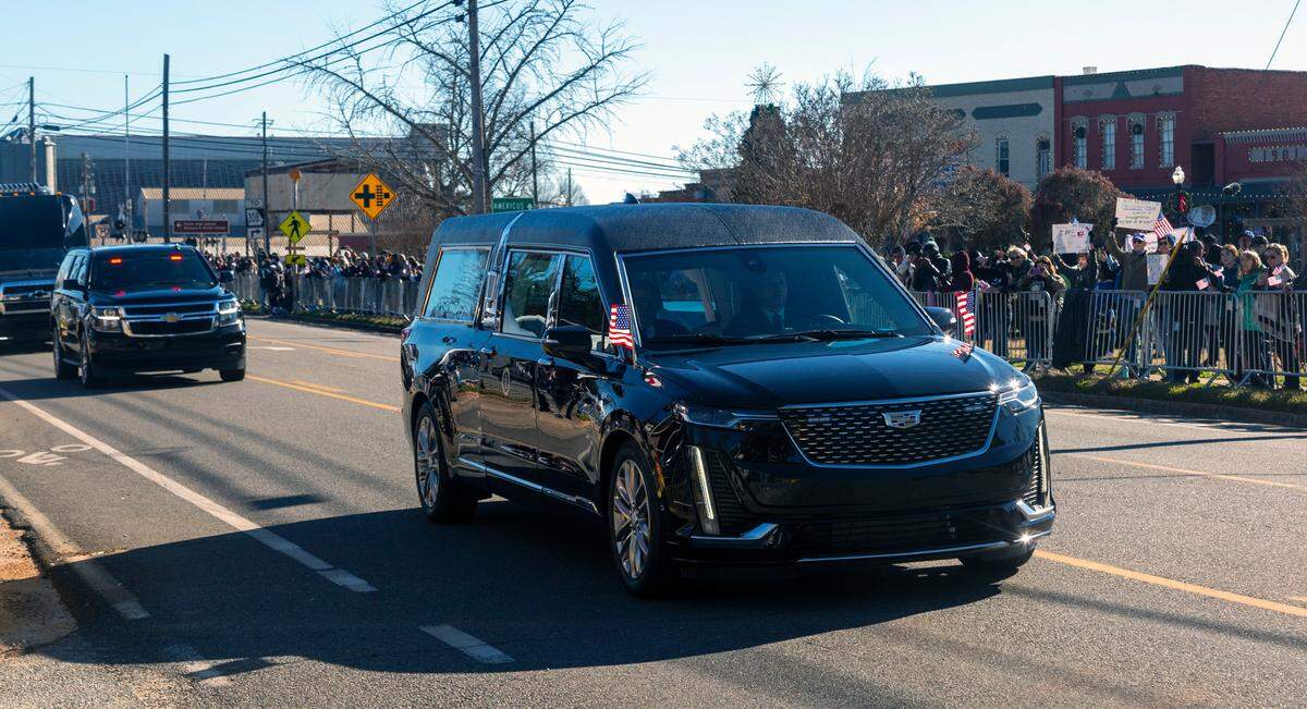 The hearse carrying Jimmy Carter passes through downtown Plains, Georgia the morning of Jan. 4, 2025.