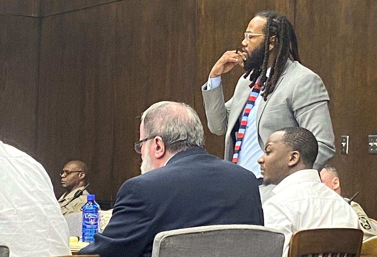 Defendant Homer Upshaw listens as his attorney William Kendrick stands to make an objection during a a gang-related Columbus murder trial.