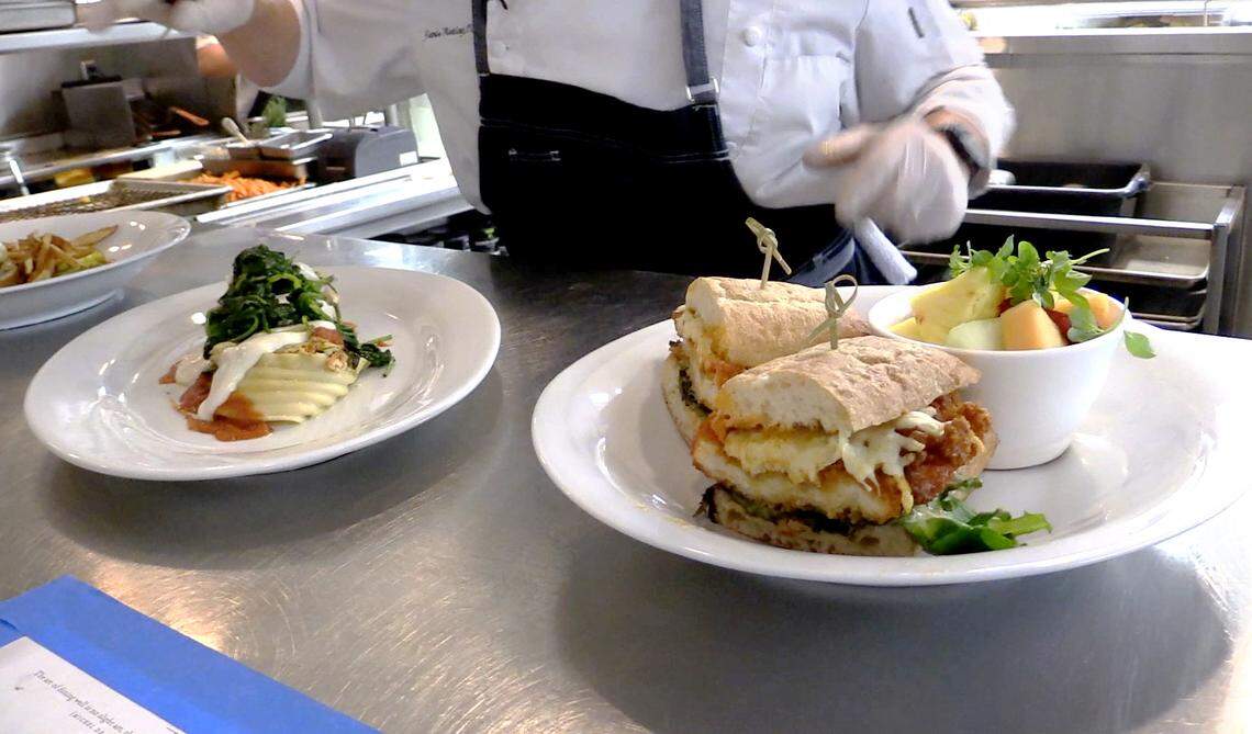 Two of five lunch entrees for Restaurant Week 2018 at Epic Restaurant: vegetable lasagna, left, and Spicy Chicken Panini.
