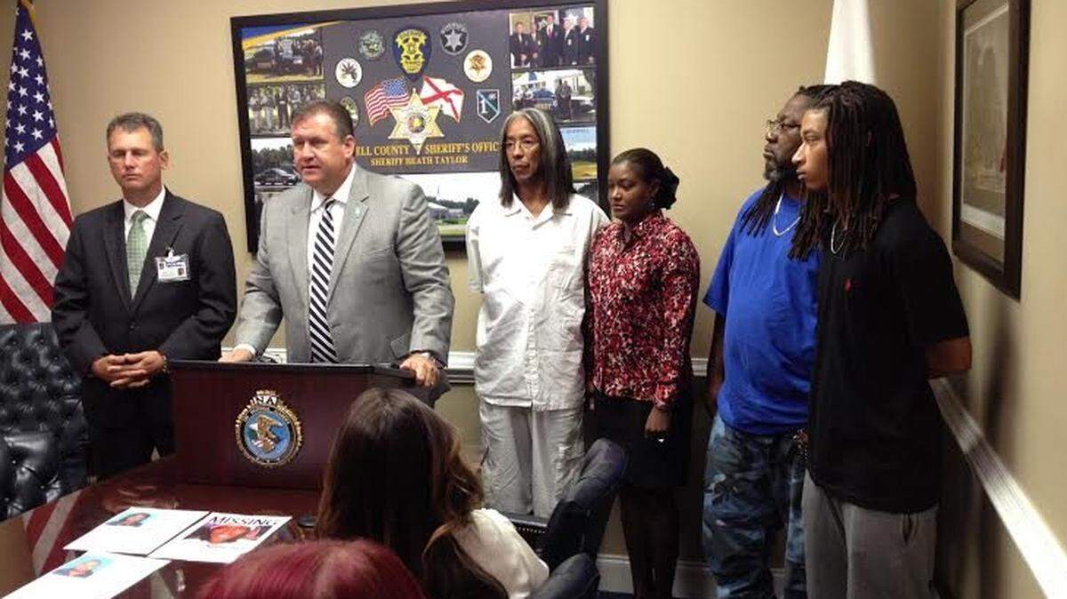 Russell County Sheriff Heath Taylor (podium) announces new details in the investigation into the death of 19-year-old Keonte Chavis, whose body was found Saturday. Chavis’ family is also pictured.