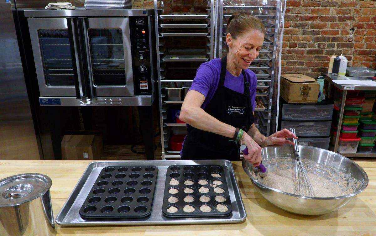 Tracy St. John makes a fresh batch of dog treats Friday morning at Three Dog Bakery, at 1106 Broadway in downtown Columbus, Georgia. Three Dog Bakery offers fresh baked treats made in-house. 04/19/2024
