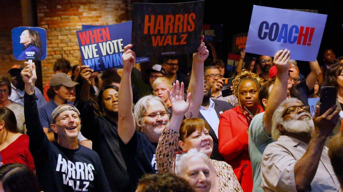 Pepole cheer as Tim Walz, the governor of Minnesota and vice president nominee of the Democratic party, speaks Tuesday evening at the Columbus Georgia Convention and Trade Center in Columbus, Ga. 10/29/2024