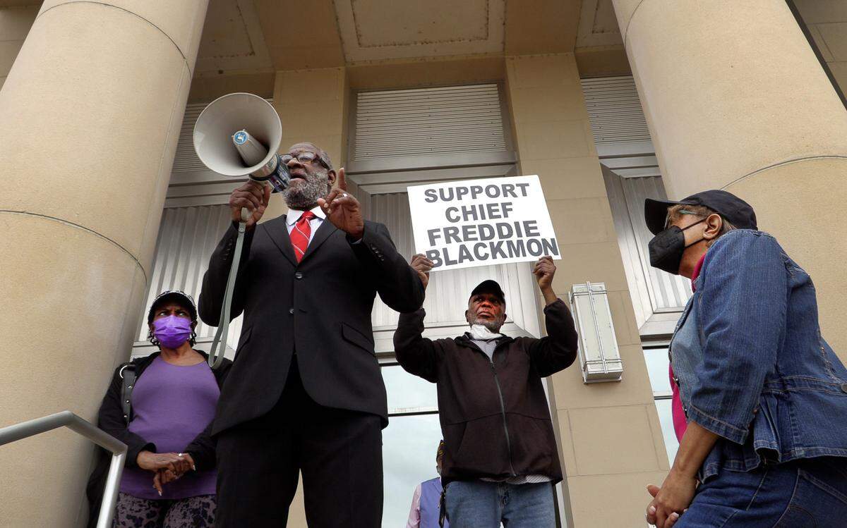 Wane Hailes, president of the Columbus branch of the NAACP, speaks Tuesday night during a rally outside the City Services Center in support of Columbus Police Chief Freddie Blackmon. 03/28/2023