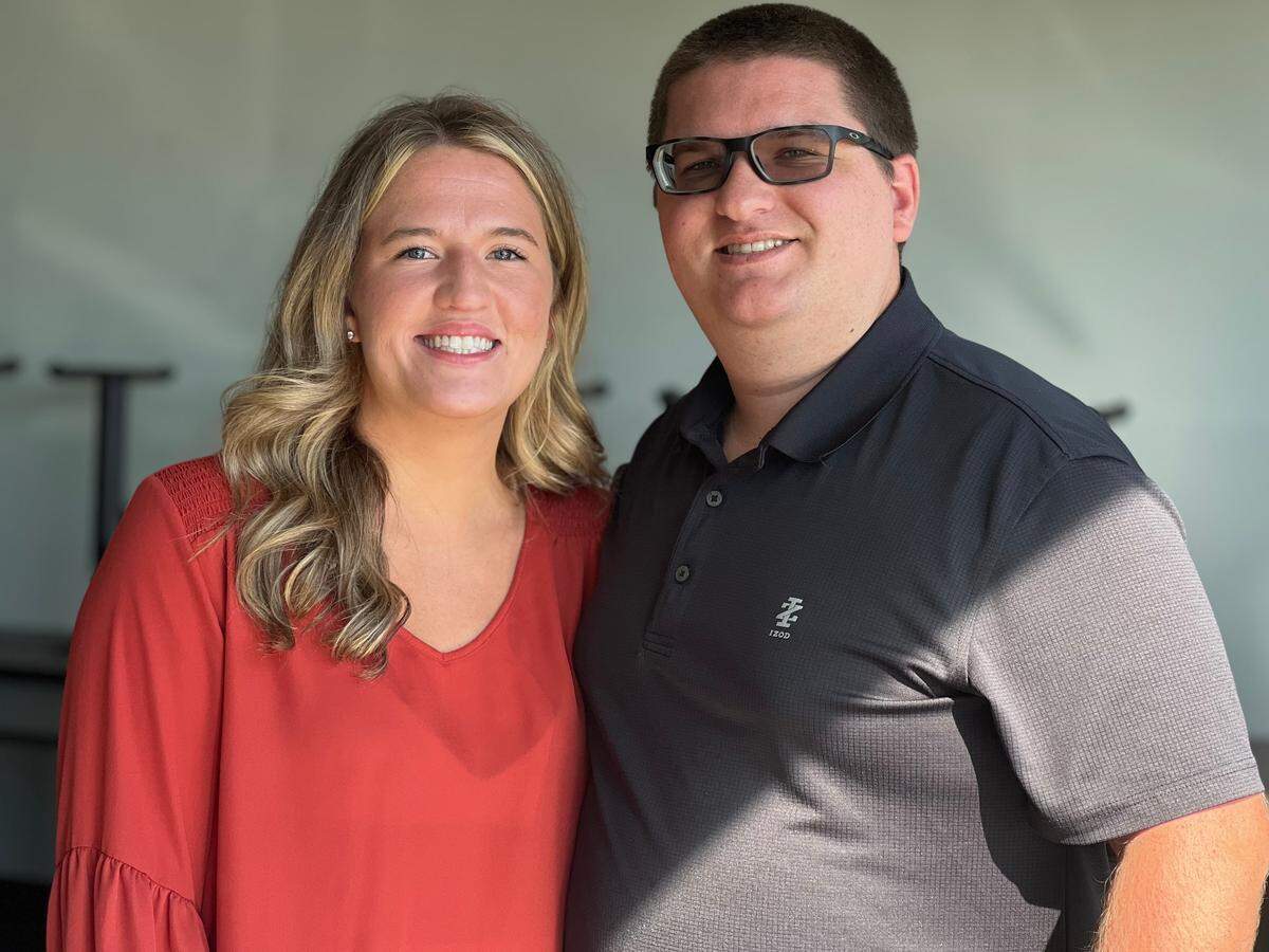 Kenneth Cook and his wife Shelby are photographed at the new Cook’s BBQ location in Phenix City.