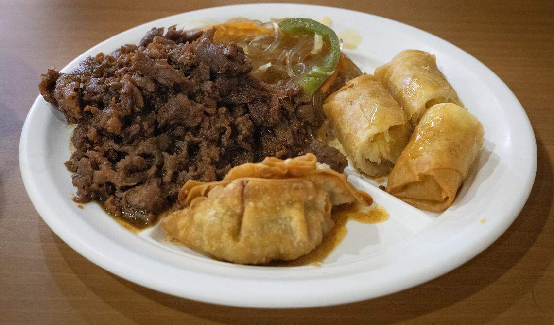 Ledger-Enquirer reporter Sundi Rose ordered the Bulgogi lunch special at Golden Chopstix in Columbus, Georgia. It comes with japchae, spring rolls, yaki mandu, rice, and side vegetables. 02/23/2024