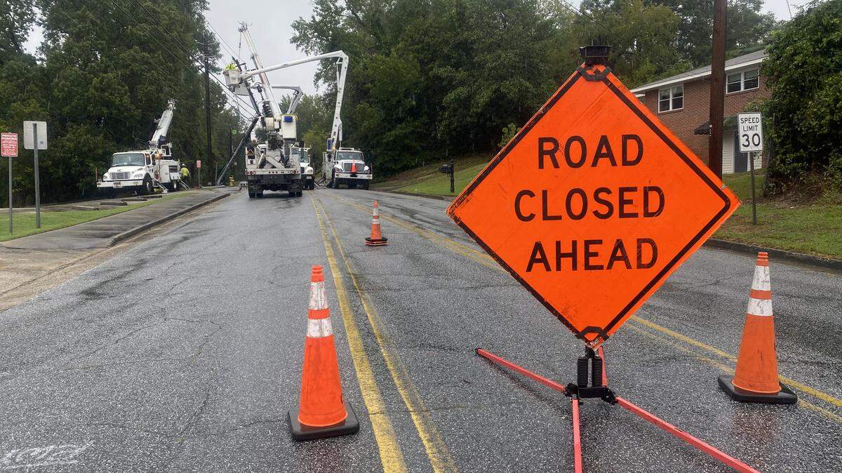 Norris Road at the intersection with Fuller Street was blocked off Thursday as crews from AT&T and Service Electric Company worked to repair a utility poll that was broken in half and caused a power outage in the area.